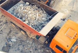 Construction site debris (concrete, lumber, roofing).  